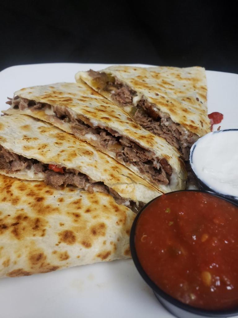 Steak Quesadilla · Shaved steak, mozzarella cheese, red & green bell peppers, and caramelized onions, with salsa & sour cream