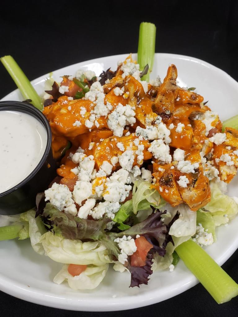 Buffalo Chicken Salad · Mixed greens, marinated tomatoes, celery, bleu cheese crumbles, choice of a grilled chicken breast (gluten free) or fried chicken tenders tossed in mild wing sauce, buttermilk ranch dressing.