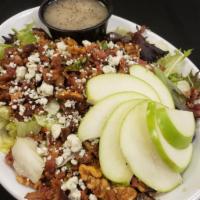 Apple Salad  · Mixed greens, granny smith apples, bleu cheese crumbles, candied walnuts, bacon, poppyseed d...