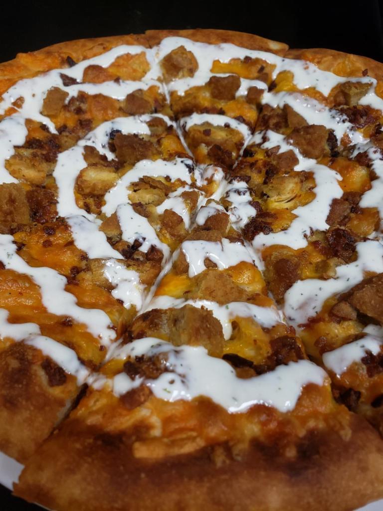 Chicken Bacon Ranch Pizza  · Breaded chicken, bacon, mozzarella, cheddar jack, topped with buttermilk ranch dressing.