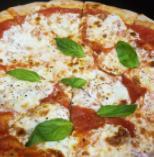 Margherita Pizza  · Red sauce, fresh mozzarella, basil, Italian seasoning, garlic, and oil drizzle.