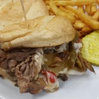 Hooligans Bomber  · Thin sliced ribeye, marinated mushrooms, caramelized
onions, bell peppers, and melted provol...