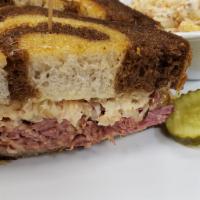 The Reubens  · Your choice of house-made corned beef or roasted turkey breast, sauerkraut, 1000 island dres...