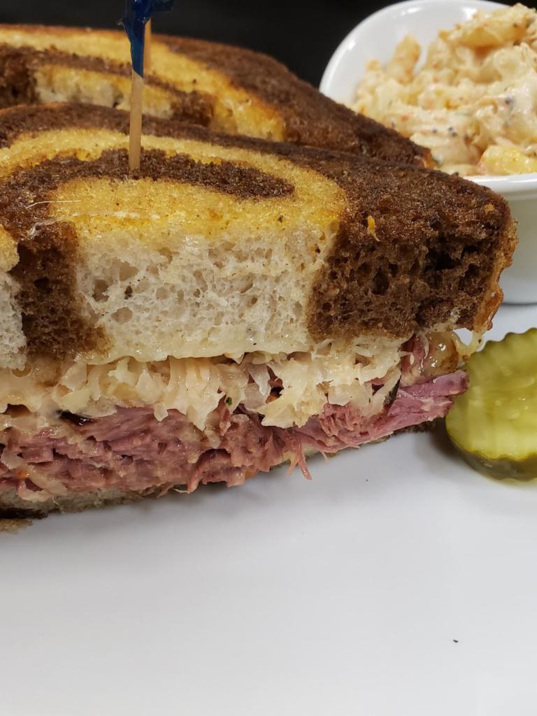 The Reubens  · Your choice of house-made corned beef or roasted turkey breast, sauerkraut, 1000 island dressing, and melted Swiss on toasted marble rye.