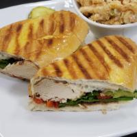 Chicken Panini  · Grilled chicken breast, avocado, roasted red peppers, spinach, melted provolone and garlic a...