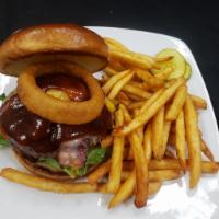 Cattleman Burger  · Lettuce, tomato, bacon, cheddar jack, onion ring, BBQ sauce.