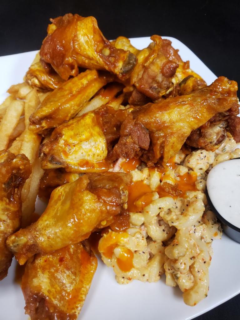Chicken Wing Plate · A dozen of our jumbo chicken wings tossed in your choice of wing sauce and served with a side of house made bleu cheese dressing.