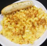 Mac and Cheese  · Cavatappi pasta tossed in our house-made cheese sauce, then topped with seasoned & toasted p...