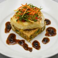 Seared Chilean Seabass · Crab fried rice & black bean garlic sauce.