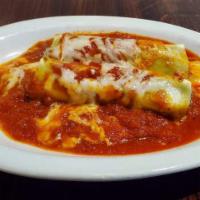 Cannelloni · Pasta tubes filled with ground beef, spinach, and ricotta and topped with mozzarella cheese ...