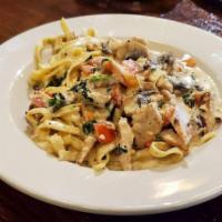 Chicken Florentine Pasta · Chicken sauteed with green onions, spinach, mushrooms, and garlic in a cream sauce tossed wi...