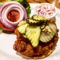 Fried Chicken Sandwich · Our House Southern Fried Chicken recipe topped with pickles, lettuce, tomato, onion, and caj...