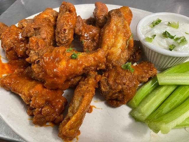 Buffalo Wings (8) · 8 wings served hot, medium, or mild.

JUNE 2021 - due to skyrocketing food costs, we are TEMPORARILY raising the price of this item