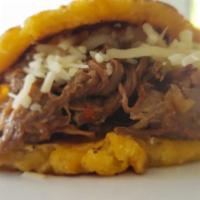 Exotic Sweet Corn Pancake ( Cachapa la Exotica ) · Served with shredded grill pork and hand made cheese. Thick and tasty pancakes made from mai...