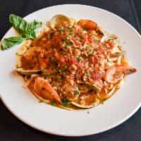 Seafood Fra Diavolo · Jumbo shrimp, whole clams and fresh haddock served over linguine in a spicy marinara sauce. 