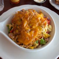Western Skillet · 2 eggs prepared to your liking, with ham, onion and bell peppers, topped with hashbrowns and...