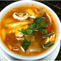 Tom Yum Soup · Classic spicy Thai lemongrass soup with mushrooms and scallion with your choice of shrimp or...