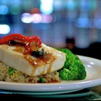 Chilean Sea Bass  · Grilled 8 oz. Chilean sea bass topped with chili sauce served with steamed broccoli and ka-p...