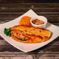 Chiles Rellenos Plate · Grilled California green chiles stuffed with cheese and salsa ranchera. Served with rice, re...