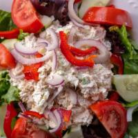 Chicken Salad over Greens · Fresh chicken salad over a bed romaine lettuce with tomatoes, a
nd onions.