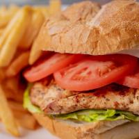Grilled Chicken Supreme Sandwich · Charcoal grilled chicken breast wtih lettuce, tomato and french
fries.