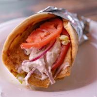 Chicken Gyro Sandwich · Strips of chicken gyro meat with lettuce, tomato, onion, and tz
atziki sauce served on a pita