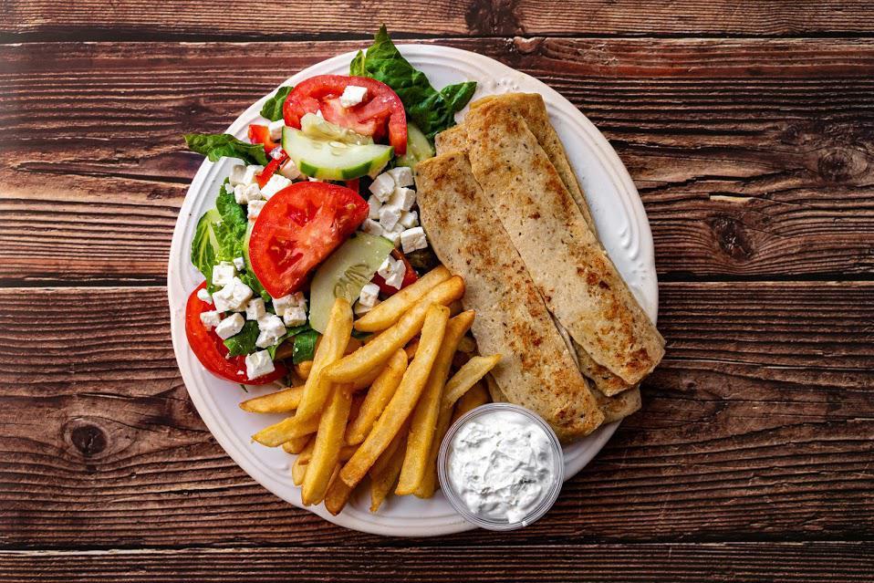 Chicken Gyro Dinner · Strips of chicken gyro served with french fries or rice, Greek
salad, pita bread and tzatziki sauce.
