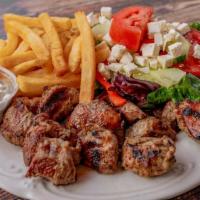 Souvlaki Dinner · Served with 2 sticks of tender cubes of pork, french fries or r
ice, Greek salad, pita brea...