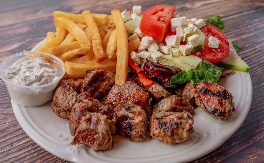 Souvlaki Dinner · Served with 2 sticks of tender cubes of pork, french fries or r
ice, Greek salad, pita bread and tzatziki sauce.