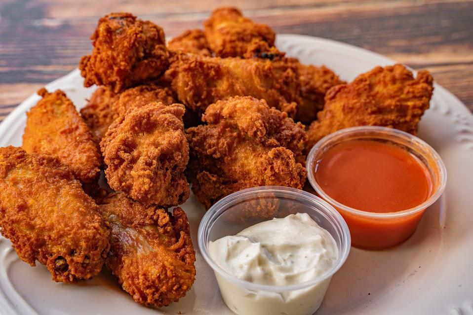 Buffalo Wings Tray · Comes with bleu cheese and hot sauce.