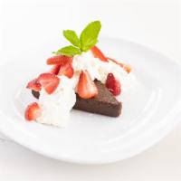 FLOURLESS CHOCOLATE CAKE [GF][VEG] · with whipped cream, strawberries, powdered sugar & a mint sprig