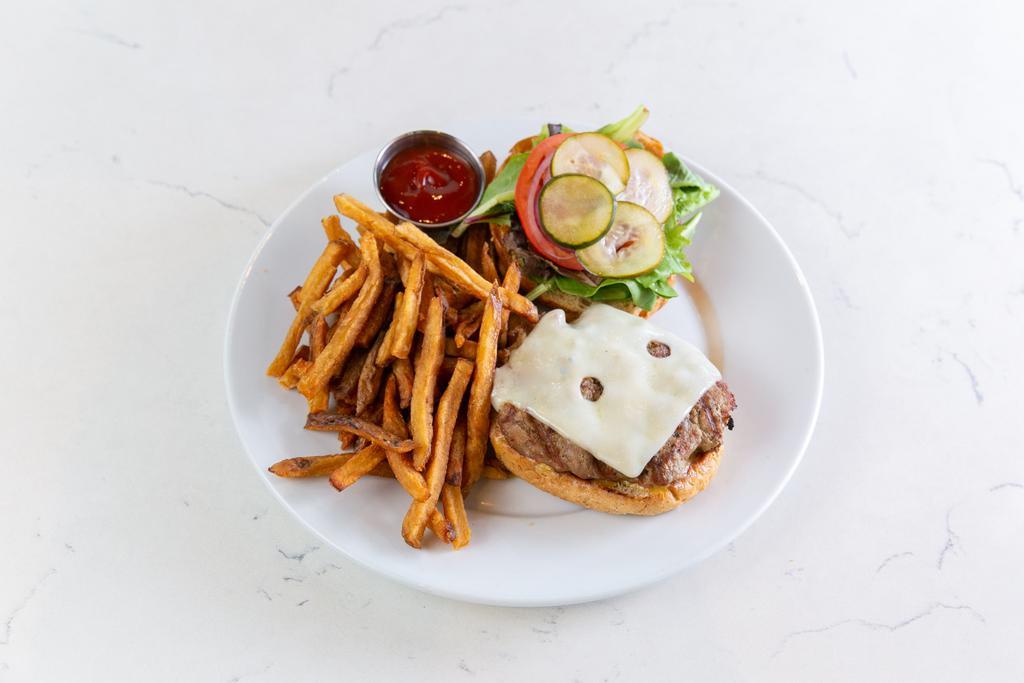 The (T) Burger · All-natural grilled turkey*, honey dijon mustard, mixed greens, tomato, house-made pickles, red onion & choice of swiss, cheddar or mozzarella cheese served on a whole-wheat bun.