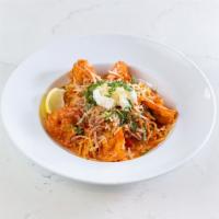 Spicy Shrimp Pasta · Organic whole-wheat spaghetti pasta with spicy shrimp, basil chiffonade, garlic, tomatoes, s...