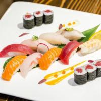 Sushi Deluxe · Chef choice of 9 pieces of sushi and Tuna  roll.