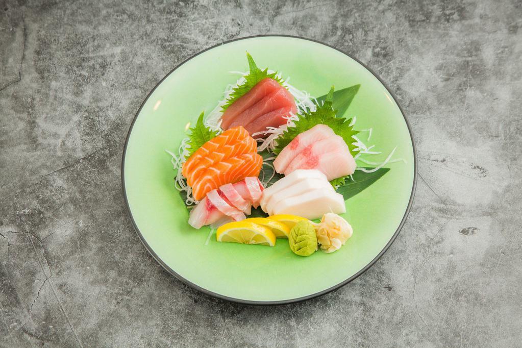 D05. Sashimi Regular · 15 pieces sashimi. with 3 tuna, 3 salmon , 3fluke, 3 seabass, 3 white tuna . Served with miso soup and salad.