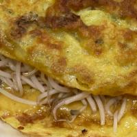5. Banh Xeo · Crepe. Rice pancake folded in 1/2 and filled with shrimp, meat, sprouts, served with vegetab...
