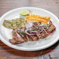 Carne Asada a la Tampiquena · 10 oz. Grilled ribeye steak served with rice, beans, grilled cheese, and grilled cactus.