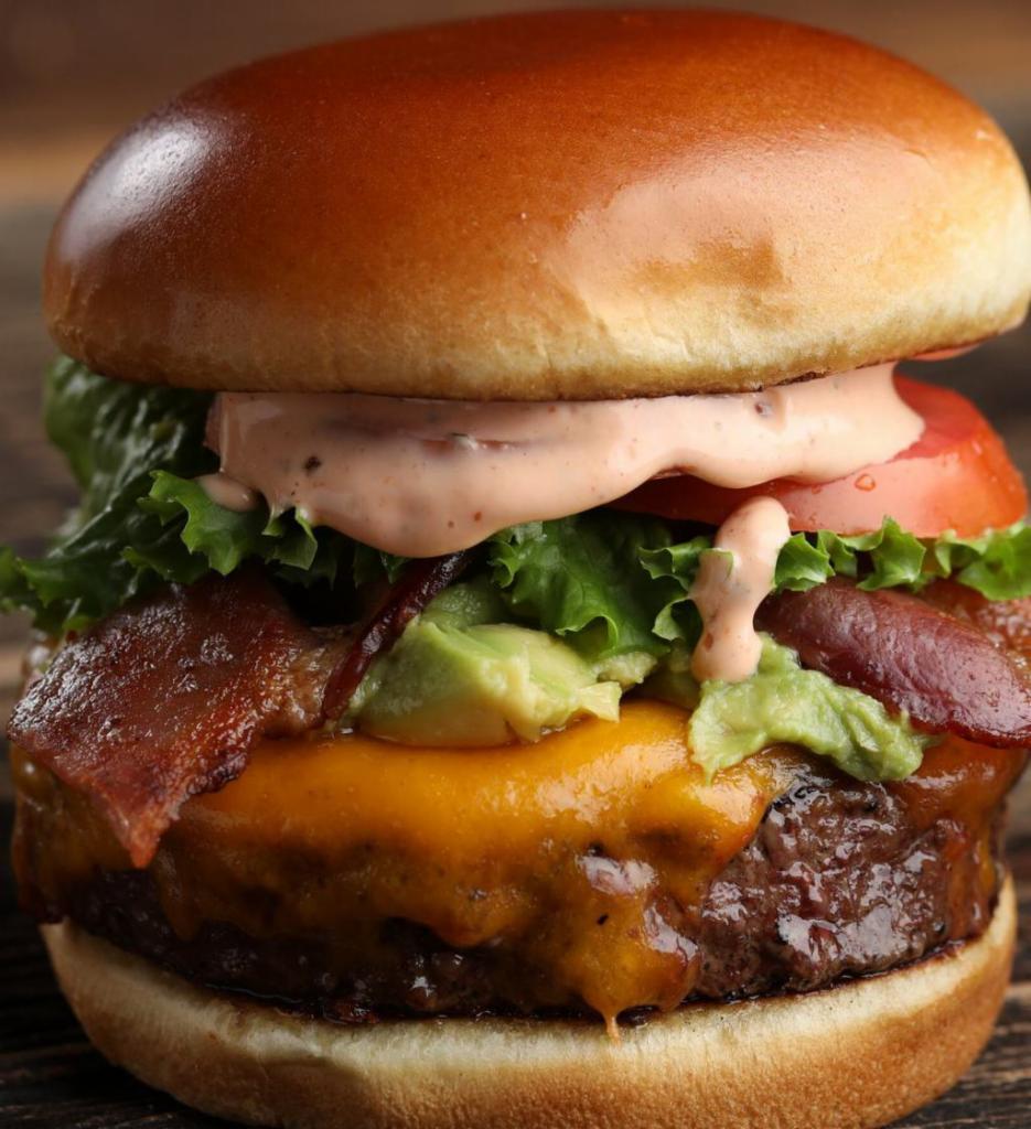 Classic Burger · 8 oz meat, cheddar cheese, brioche bread, lettuce, tomatoes and onions