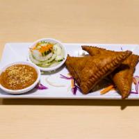 2 Pieces Curry Puffs · Mixed vegetables and ground chicken stir-fried with curry powder wrapped with pastry and fri...