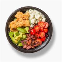 Crispy Chicken Salad · Organic greens, crispy chicken, avocado, bacon, bleu cheese, tomatoes and choice of dressing.