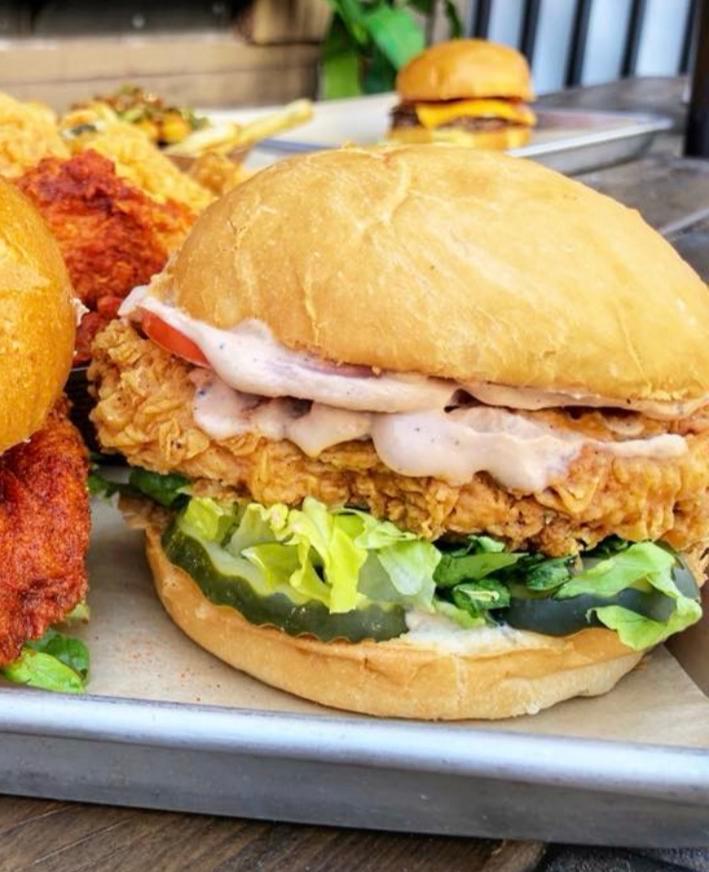 Crispy Chicken Sandwich · Crispy chicken breast Flippin’ sauce, lettuce and pickles. Served with French Fries. Upgrade to Specialty fries or house salad.