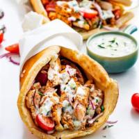 Chicken Gyro Wrap · Chunks of Chicken wrapped in Gyro bread with Lettuce, Tomato, Onion, Green peppers & Gyro sa...