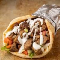Lamb Gyro Wrap · Chunks of Lamb wrapped in Gyro bread with Lettuce, Tomato, Onion, Green peppers & Gyro sauce