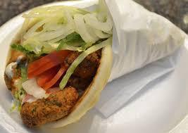 Falafel (vegetarian) Gyro Wrap · Chunks of Falafel wrapped in Gyro bread with Lettuce, Tomato, Onion, Green peppers & Gyro sa...