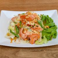 Papaya Salad · Green papaya, carrots, green beans, tomatoes with spicy lime dressing and peanuts. Served on...