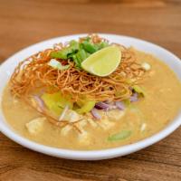Kao Soi · Eggs noodles bathed in our red sauce along with onions, celery and pickled mustard, topped w...