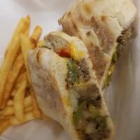 Cheesesteak Panini · Comes with peppers and onion.