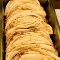 Naan a Akbar · Unleavened bread baked in the clay oven at a special temperature. Served piping hot.