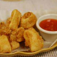 A2. Fried Calamari · Fresh squid tossed in light batter and deep-fried until golden brown, served with mildly spi...