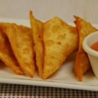 A4. Crispy Wonton · Golden fried wontons filled with ground chicken, glass noodles and shredded carrots served w...